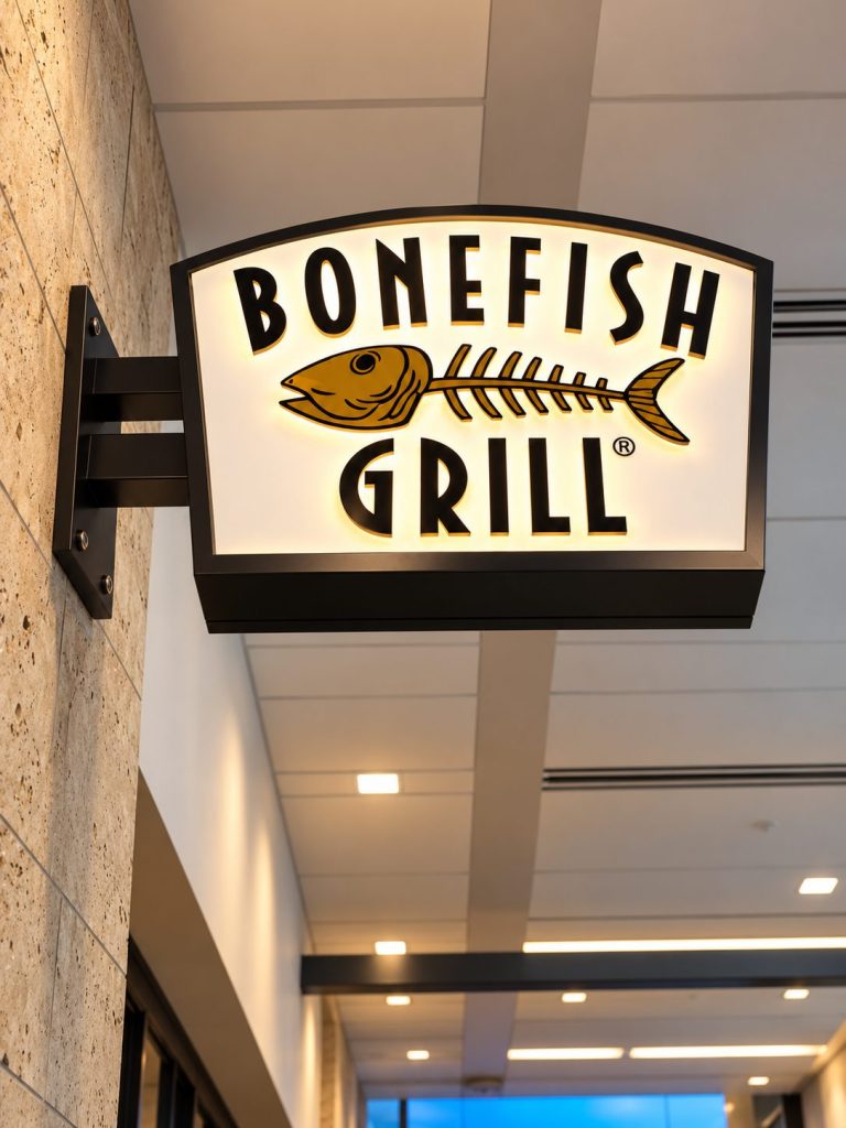 Illuminated Bonefish Grill blade sign in a hallway