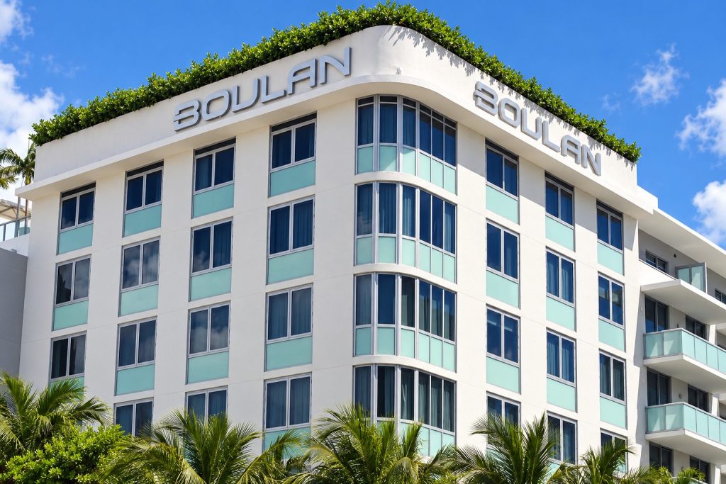 Boulan hotel facade with twin rooftop stainless steel channel letters