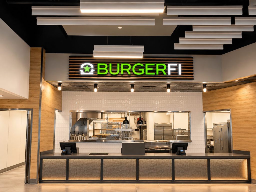 BurgerFi counter with illuminated channel letters inside the restaurant