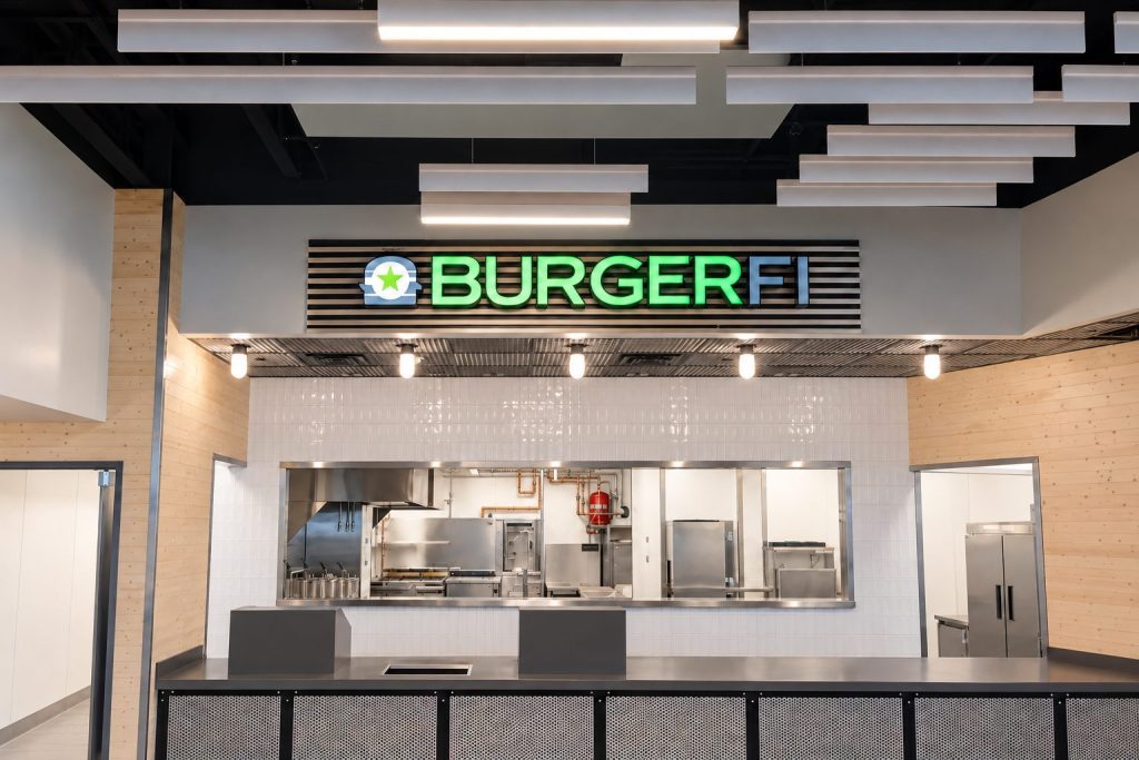 Stainless steel kitchen serving window with signage