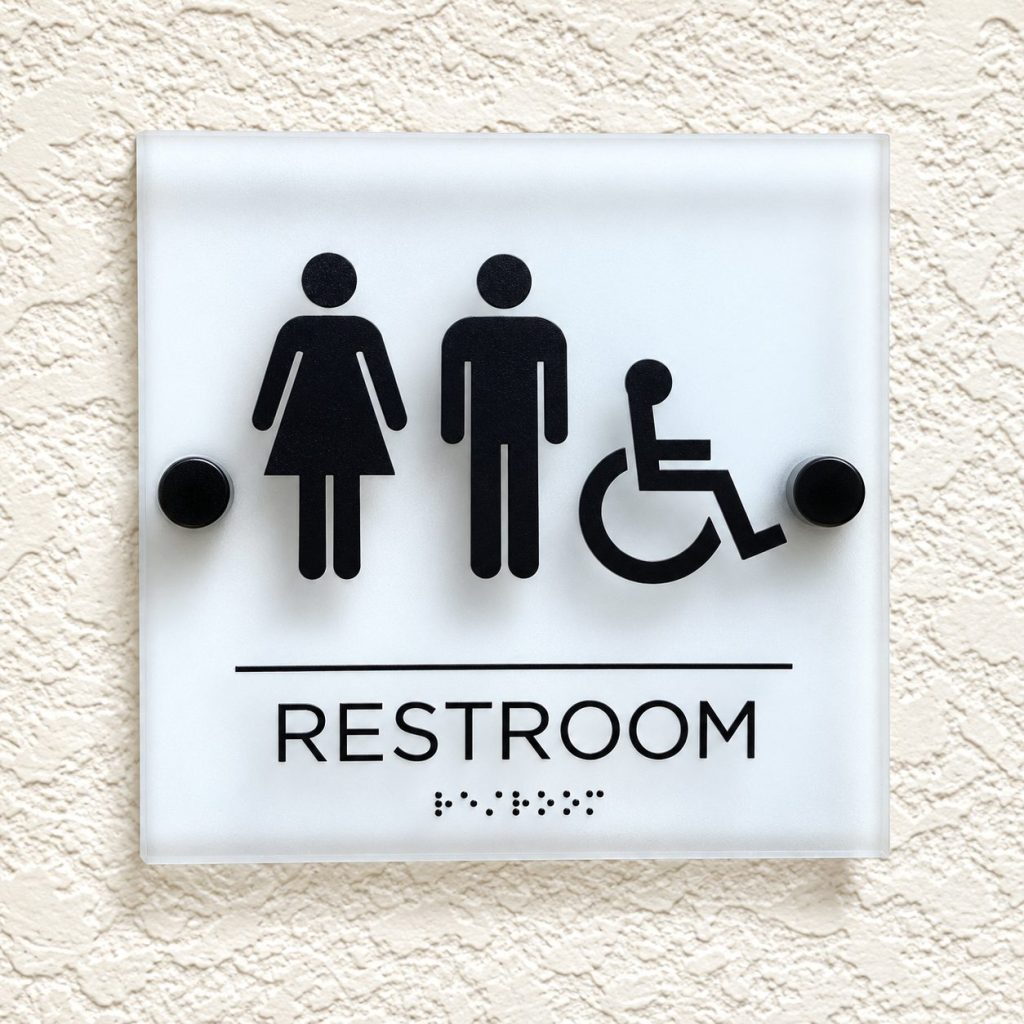 Frosted acrylic ADA restroom sign with braille
