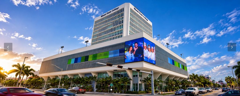 Miami Dade College building with LED displays and palm trees